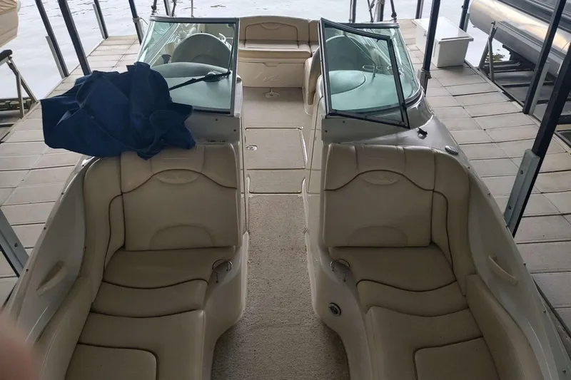 Slide: The Image of Interior view of a 2002 Sea Ray 270 Sundeck boat with beige seating. - 11