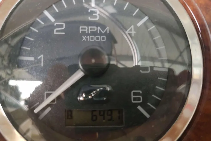 Slide: The Image of Tachometer of 2002 Sea Ray 270 Sundeck showing 649.1 hours. - 9