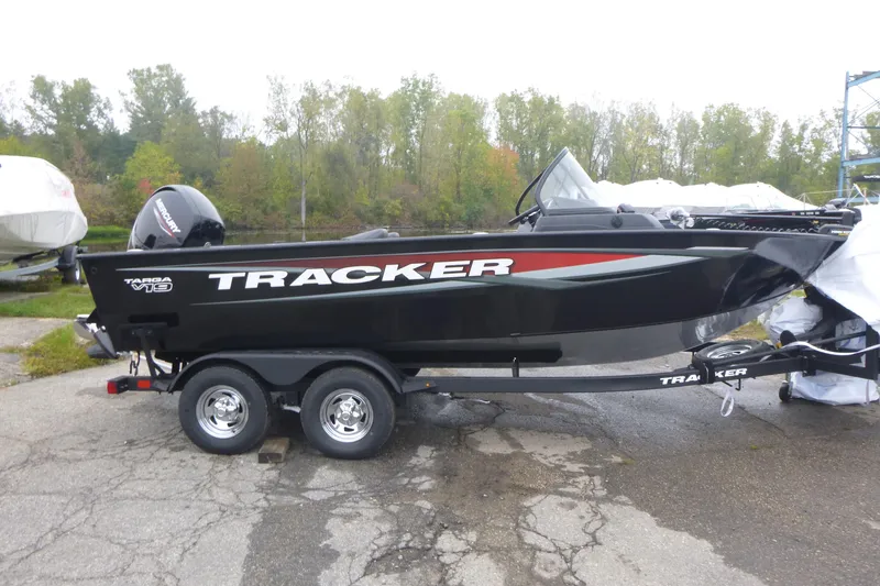 The Image of 2026 Tracker Targa V-19 Combo boat on trailer, parked outdoors. - 1