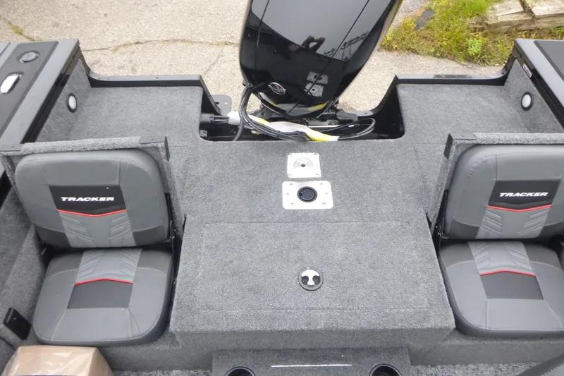 Slide: The Image of 2026 Tracker Targa V-19 Combo boat interior with swivel seat and dual windshields. - 12