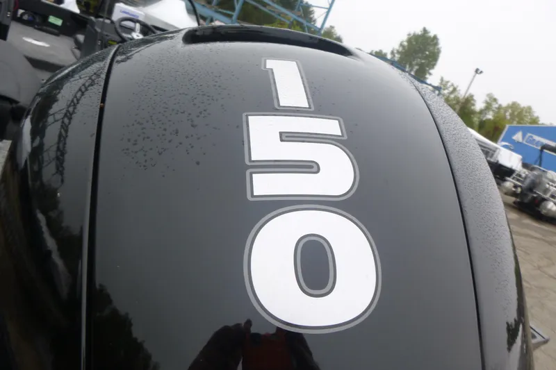 Slide: The Image of Close-up of a 2026 Tracker Targa V-19 Combo boat engine with "150" decal. - 14