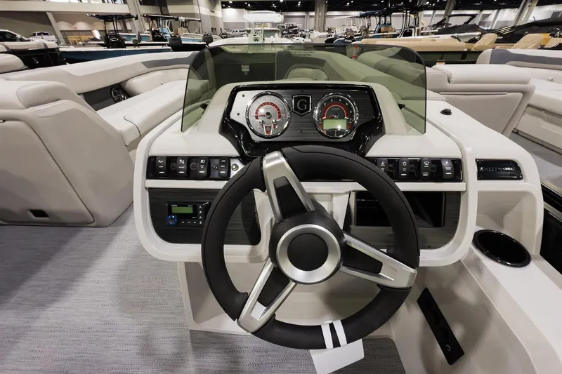 Slide: The Image of 2026 Godfrey Sweetwater 22' Cruise Special Edition Tritoon dashboard with steering wheel and controls. - 10