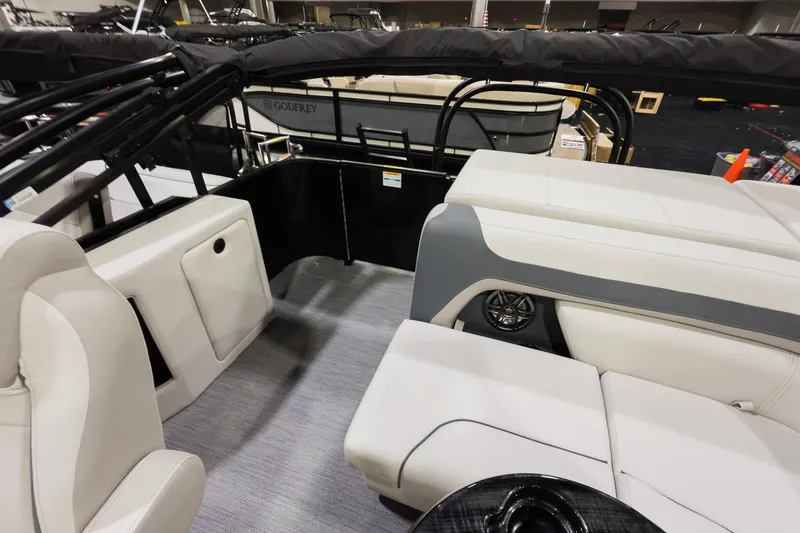 Slide: The Image of 2026 Godfrey Sweetwater 22' Cruise Special Edition Tritoon interior with plush seating and modern design. - 15