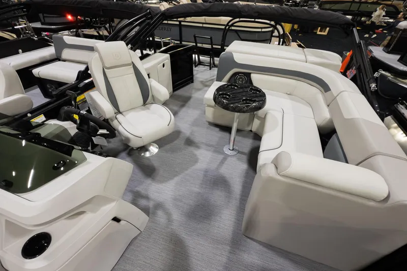 Slide: The Image of 2026 Godfrey Sweetwater 22' Cruise Special Edition Tritoon interior with plush seating and helm. - 6