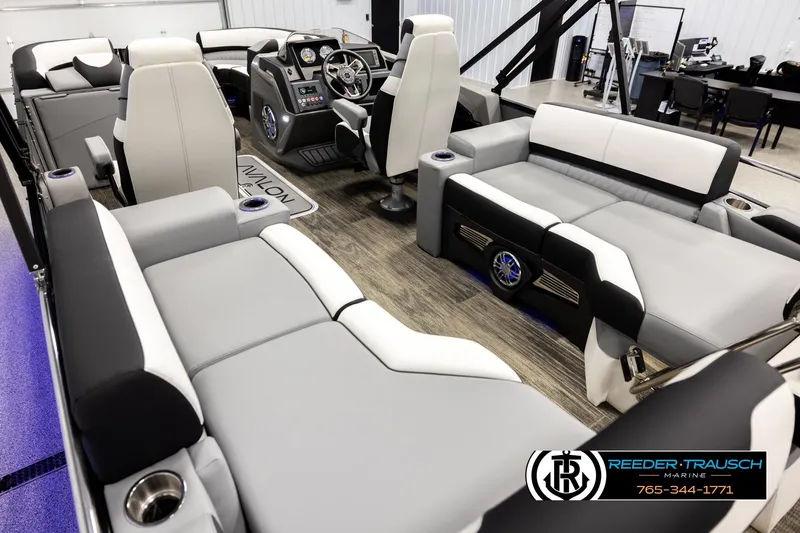 Slide: The Image of Luxurious interior of 2026 Avalon CAT QLS pontoon boat with modern seating and control panel. - 11