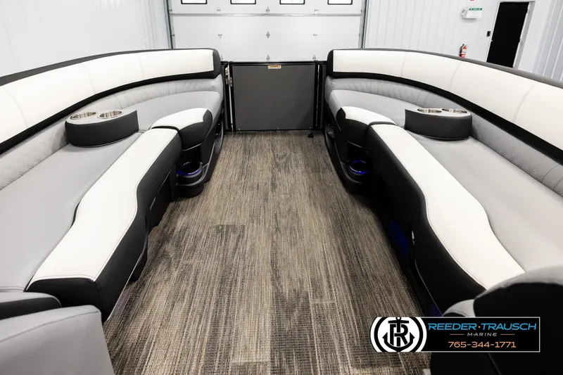 Slide: The Image of Luxurious interior of 2026 Avalon CAT QLS pontoon boat with plush seating and cup holders. - 19