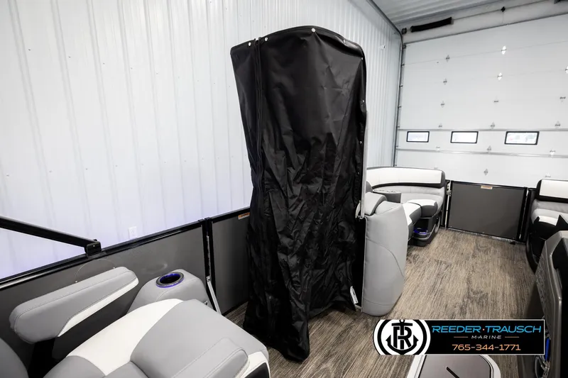 Slide: The Image of Interior of 2026 Avalon CAT QLS pontoon boat with modern seating and black cover. - 22