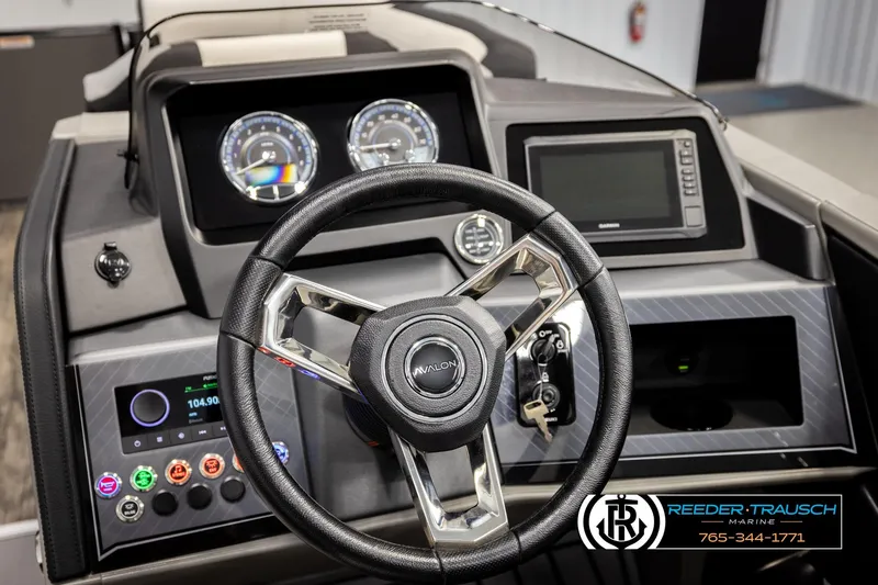 Slide: The Image of Steering console of 2026 Avalon CAT QLS boat with modern controls and displays. - 27