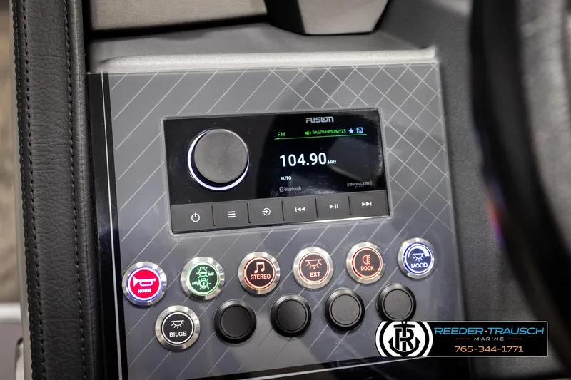 Slide: The Image of Control panel of 2026 Avalon CAT QLS boat with radio and function buttons. - 29