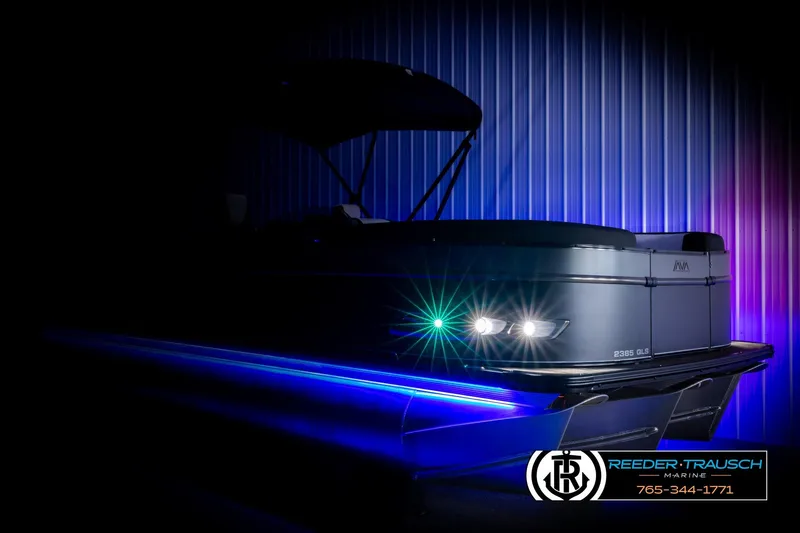 Slide: The Image of 2026 Avalon CAT QLS boat with illuminated blue lights, showcased in a dark setting. - 4