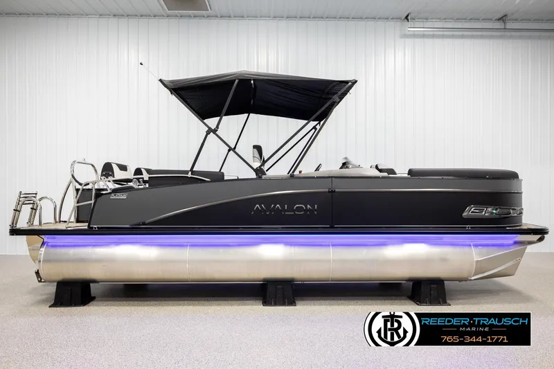 Slide: The Image of 2026 Avalon CAT QLS pontoon boat with sleek design and blue underglow lighting. - 5