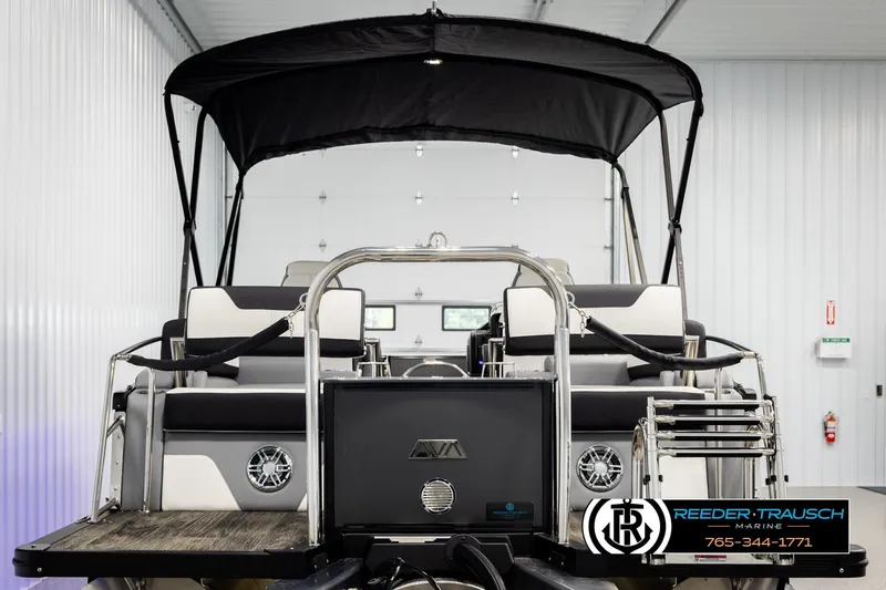 Slide: The Image of 2026 Avalon CAT QLS pontoon boat with canopy in a showroom. - 7