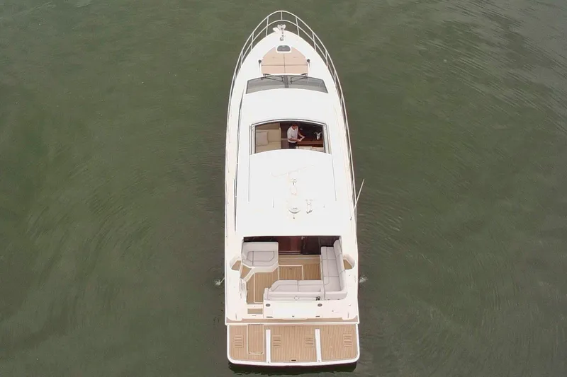 Slide: The Image of Aerial view of 2017 Sea Ray Sundancer 460 yacht on calm water. - 11
