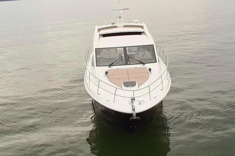 Slide: The Image of 2017 Sea Ray Sundancer 460 yacht on calm water, front view. - 12