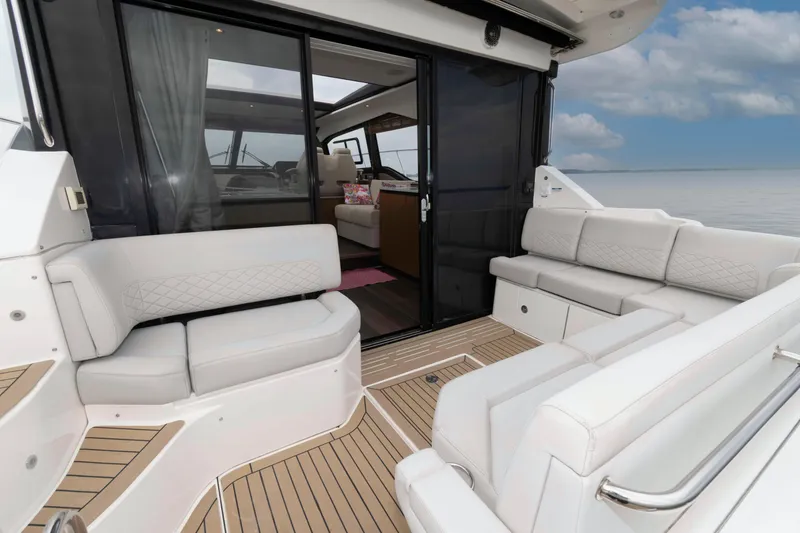 Slide: The Image of 2017 Sea Ray Sundancer 460 yacht with elegant seating and ocean view. - 13