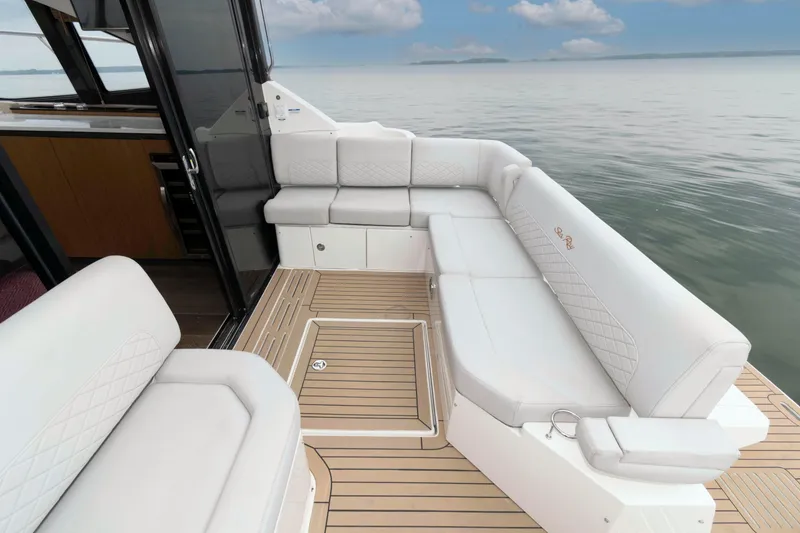 Slide: The Image of Luxurious seating area on 2017 Sea Ray Sundancer 460 yacht with ocean view. - 15