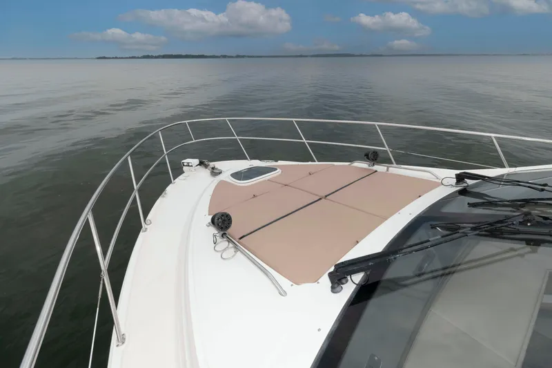 Slide: The Image of 2017 Sea Ray Sundancer 460 yacht deck with ocean view and clear skies. - 19