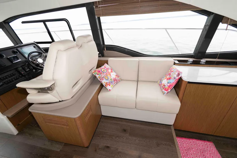 Slide: The Image of Luxurious 2017 Sea Ray Sundancer 460 yacht interior with plush seating and vibrant cushions. - 27