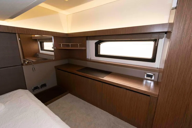 Slide: The Image of Luxurious interior of 2017 Sea Ray Sundancer 460 yacht with wood finish and window. - 36