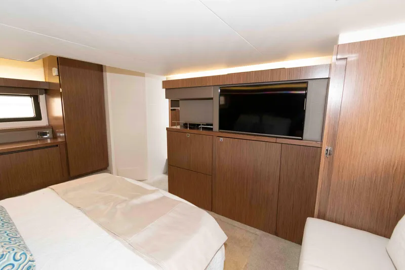 Slide: The Image of Luxurious interior of 2017 Sea Ray Sundancer 460 yacht with modern wood finish and TV. - 37