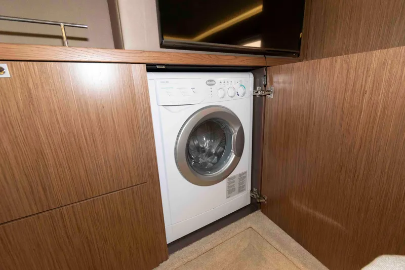 Slide: The Image of Built-in washing machine in 2017 Sea Ray Sundancer 460 yacht's wooden cabinet. - 39