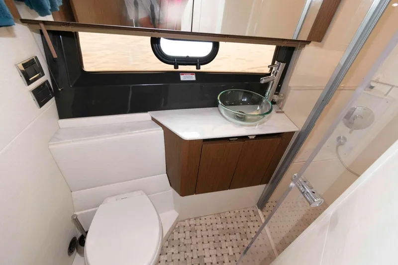 Slide: The Image of Luxurious bathroom in 2017 Sea Ray Sundancer 460 yacht with modern fixtures and glass sink. - 43