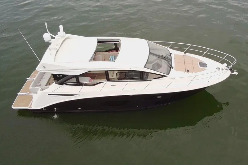 Slide: The Image of 2017 Sea Ray Sundancer 460 yacht on calm water, aerial view. - 6