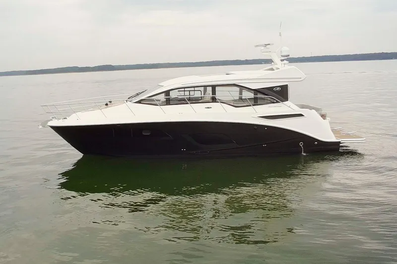 Slide: The Image of 2017 Sea Ray Sundancer 460 yacht on calm water, side view. - 8