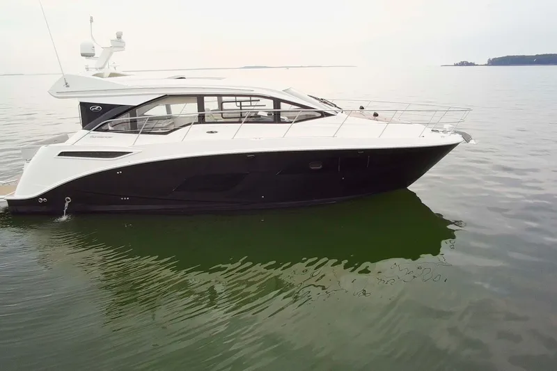 Slide: The Image of 2017 Sea Ray Sundancer 460 yacht on calm water, side view. - 9