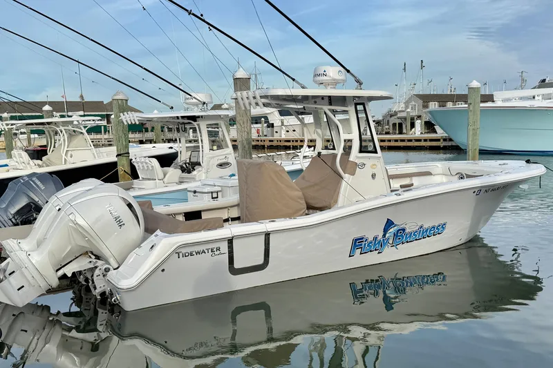 Slide: The Image of 2024 Tidewater 272 LXF boat docked, featuring Yamaha engines and "Fishy Business" branding. - 24