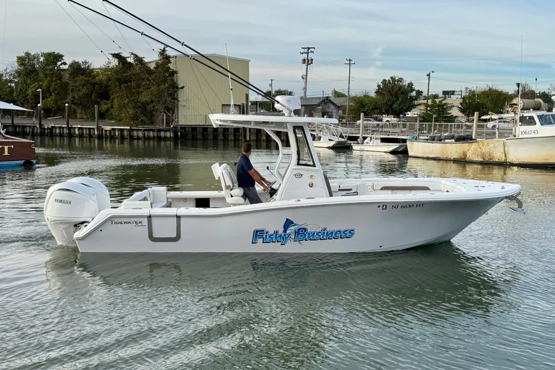 Slide: The Image of 2024 Tidewater 272 LXF boat on water, featuring Yamaha engine, labeled "Fishy Business." - 5