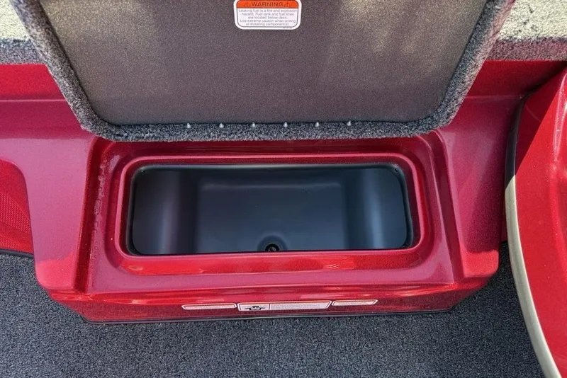 Slide: The Image of Open storage compartment in a 2026 Nitro Z17 boat, featuring a red interior. - 10