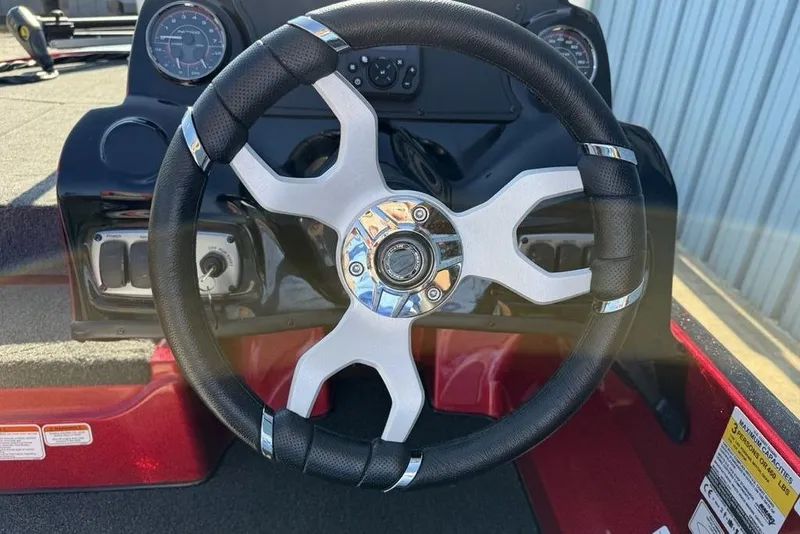 Slide: The Image of Steering wheel of a 2026 Nitro Z17 boat, featuring a modern design and dashboard controls. - 14