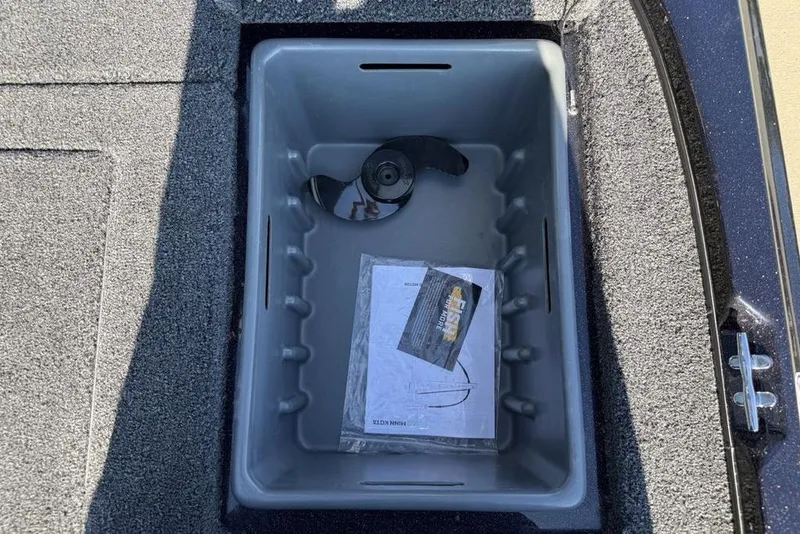 Slide: The Image of Storage compartment in 2026 Nitro Z17 boat with propeller and manual. - 22