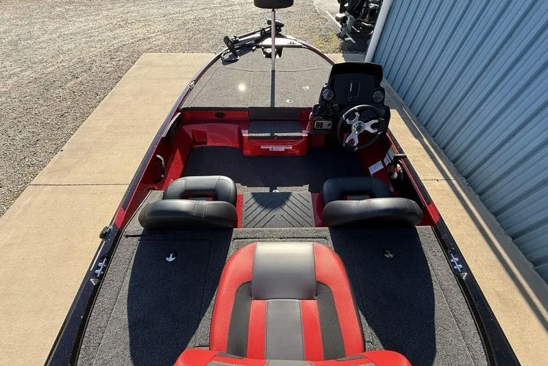 Slide: The Image of 2026 Nitro Z17 boat interior with red and black seating, steering wheel, and spacious deck. - 24