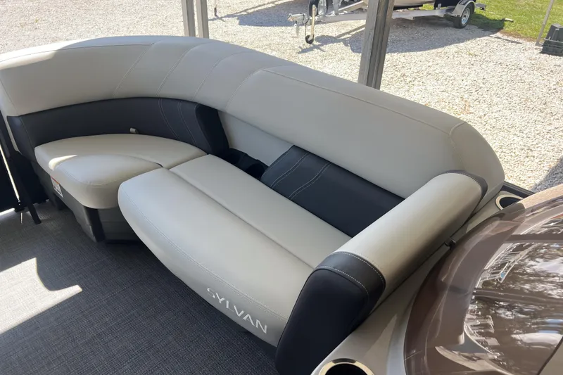 Slide: The Image of 2026 Sylvan Mirage 822 CLZ boat interior with plush seating and modern design. - 19