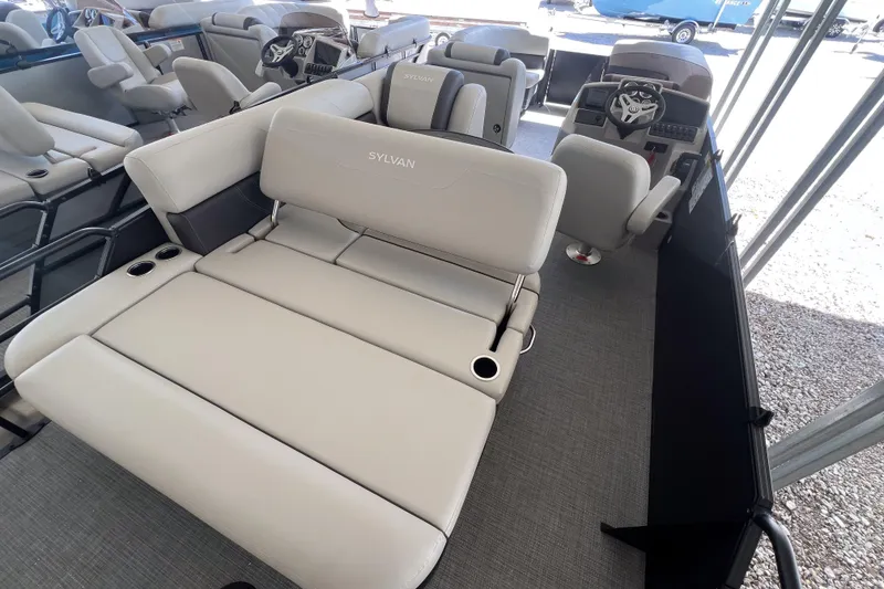 Slide: The Image of 2026 Sylvan Mirage 822 CLZ pontoon boat interior with plush seating and modern helm. - 8