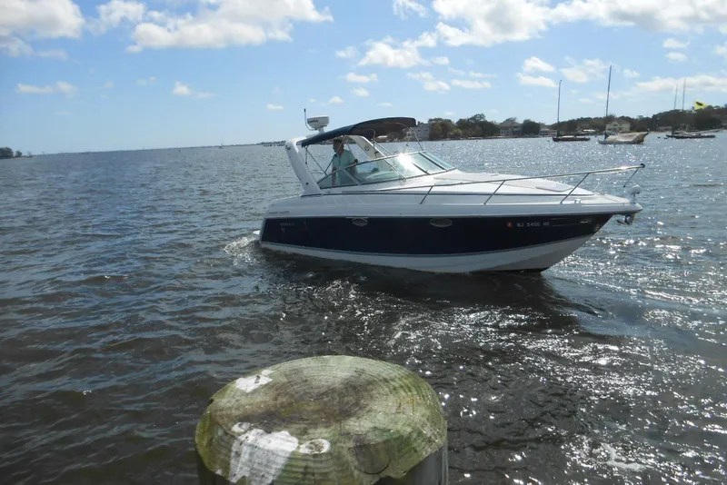 The Image of 2004 Formula 27 Performance Cruiser on a sunny day, navigating calm waters. - 0