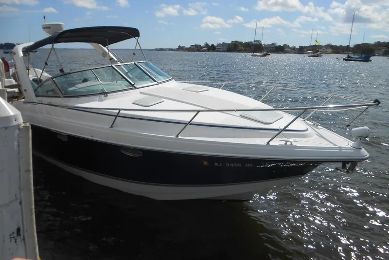 Slide: The Image of 2004 Formula 27 Performance Cruiser docked on a sunny day. - 1