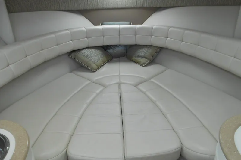 Slide: The Image of Interior of 2004 Formula 27 Performance Cruiser with cushioned seating and decorative pillows. - 11