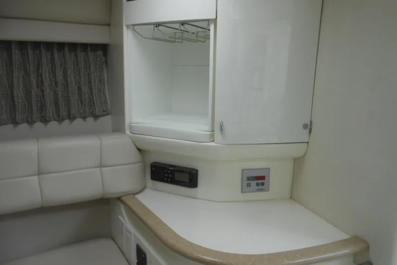 Slide: The Image of 2004 Formula 27 Performance Cruiser interior with white cabinetry and seating. - 12