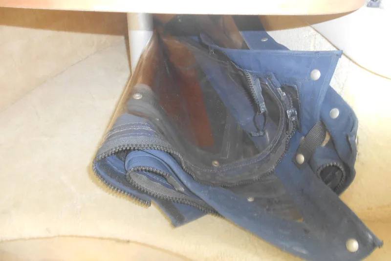Slide: The Image of Folded blue canvas with zippers inside a 2004 Formula 27 Performance Cruiser. - 15