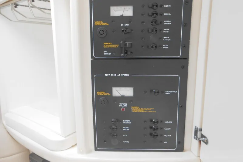 Slide: The Image of Control panel of a 2004 Formula 27 Performance Cruiser, featuring various switches and gauges. - 16