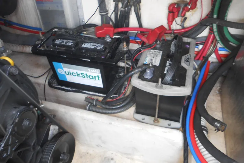 Slide: The Image of Engine compartment of a 2004 Formula 27 Performance Cruiser with dual batteries and wiring. - 19