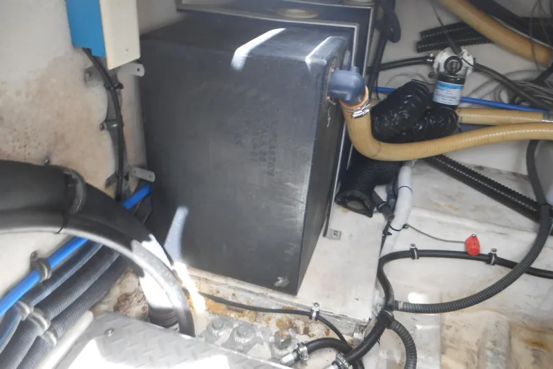 Slide: The Image of 2004 Formula 27 Performance Cruiser engine compartment with hoses and components. - 20