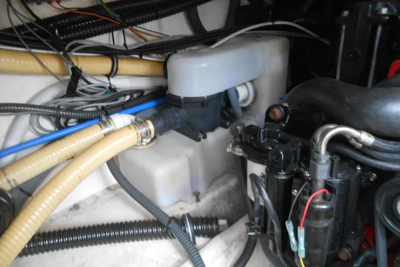 Slide: The Image of Engine compartment of a 2004 Formula 27 Performance Cruiser with hoses and wiring. - 21
