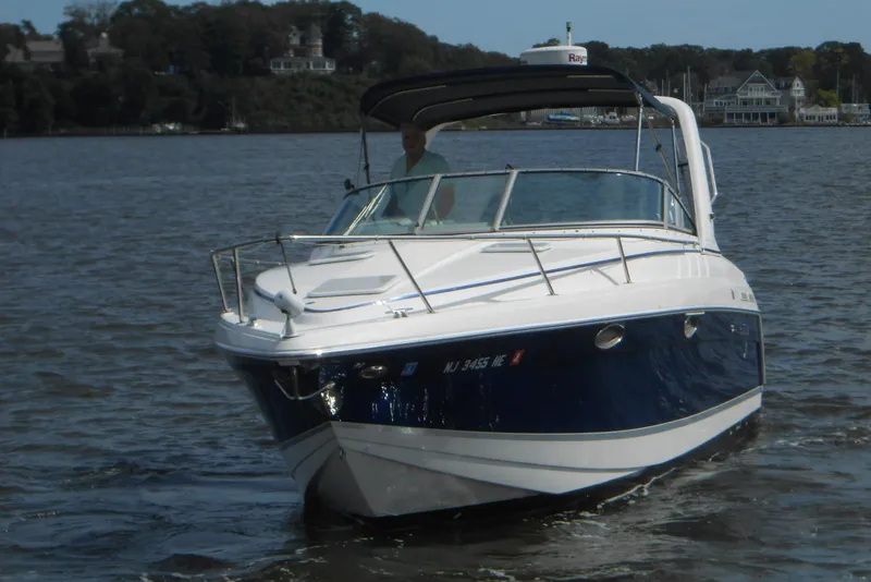 Slide: The Image of 2004 Formula 27 Performance Cruiser on calm water, showcasing sleek design and luxury features. - 5