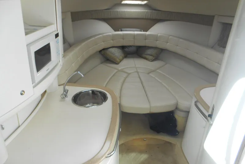 Slide: The Image of 2004 Formula 27 Performance Cruiser interior with kitchenette and cozy seating area. - 9