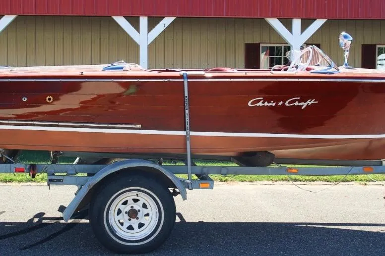 Slide: The Image of 1948 Chris-Craft 35 Double Cabin boat on trailer, classic wooden design. - 1