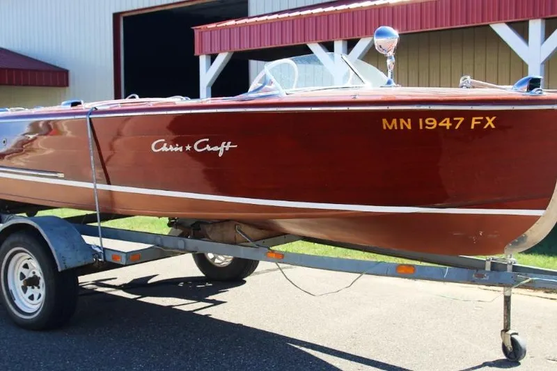 Slide: The Image of 1948 Chris-Craft 35 Double Cabin boat on trailer, classic wooden design. - 2